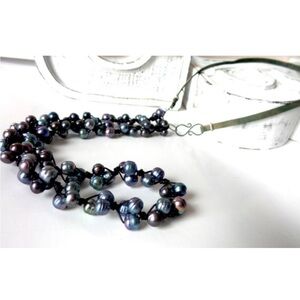 Pearls, sterling silver , leather necklace .